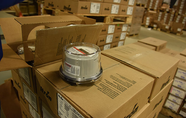 A box of new Itron meters in a warehouse